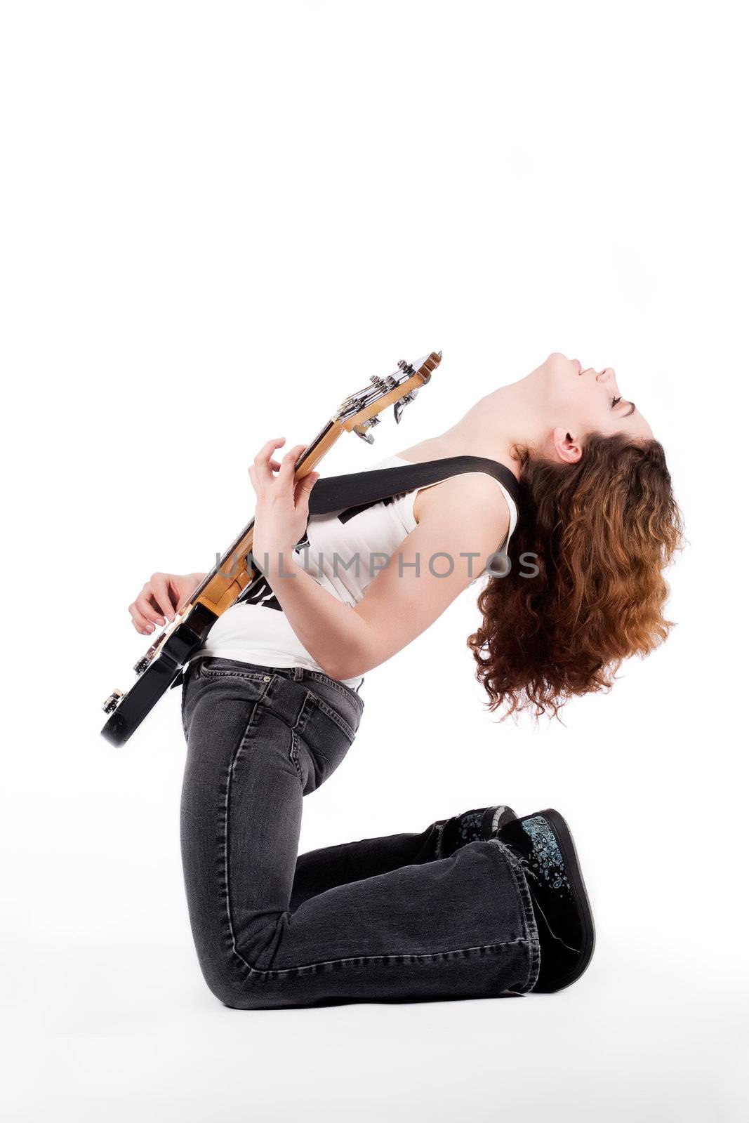 Young female bass guitar player specially isolated on white