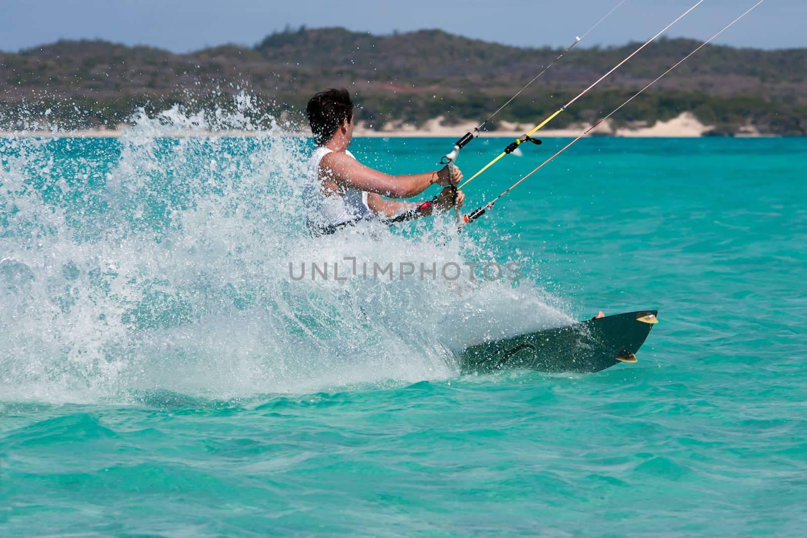 Male kitesurfer kitesurfing in the lagoon of Babaomby, Madagascar