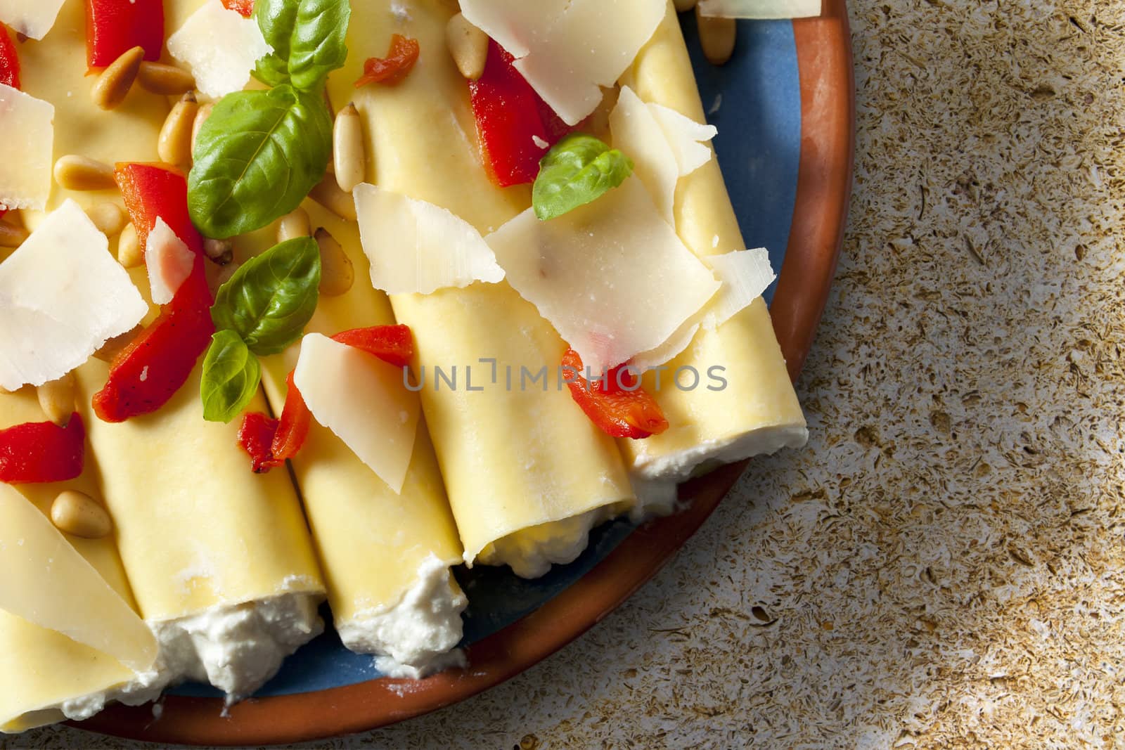 Cannelloni pasta stuffed with ricotta cheese, shot from directly above.