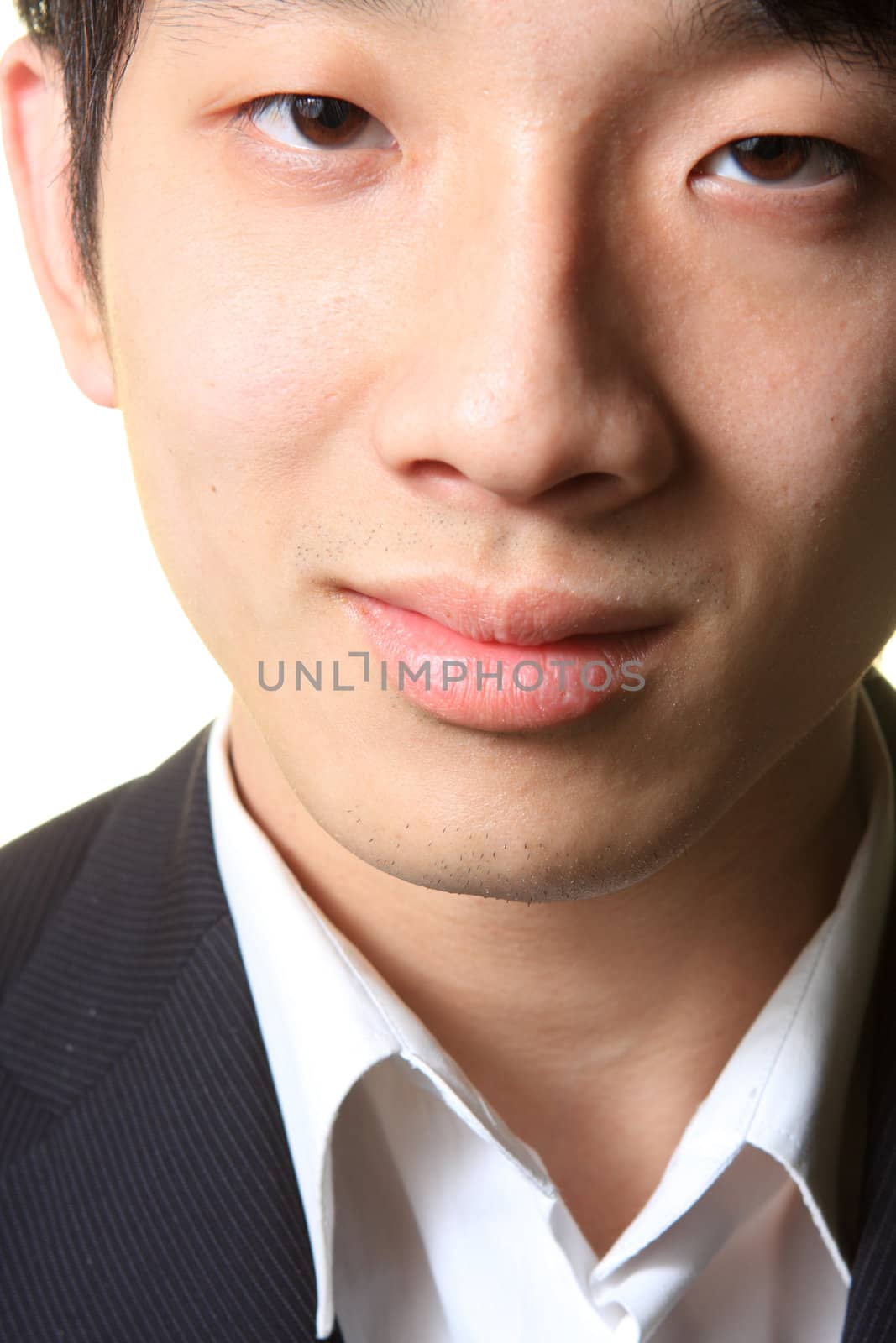 Close up portrait of man smiling on white background