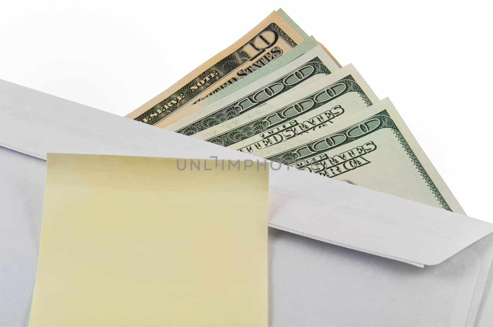 Money, an envelope and a sticker on a white background. Business concept.


