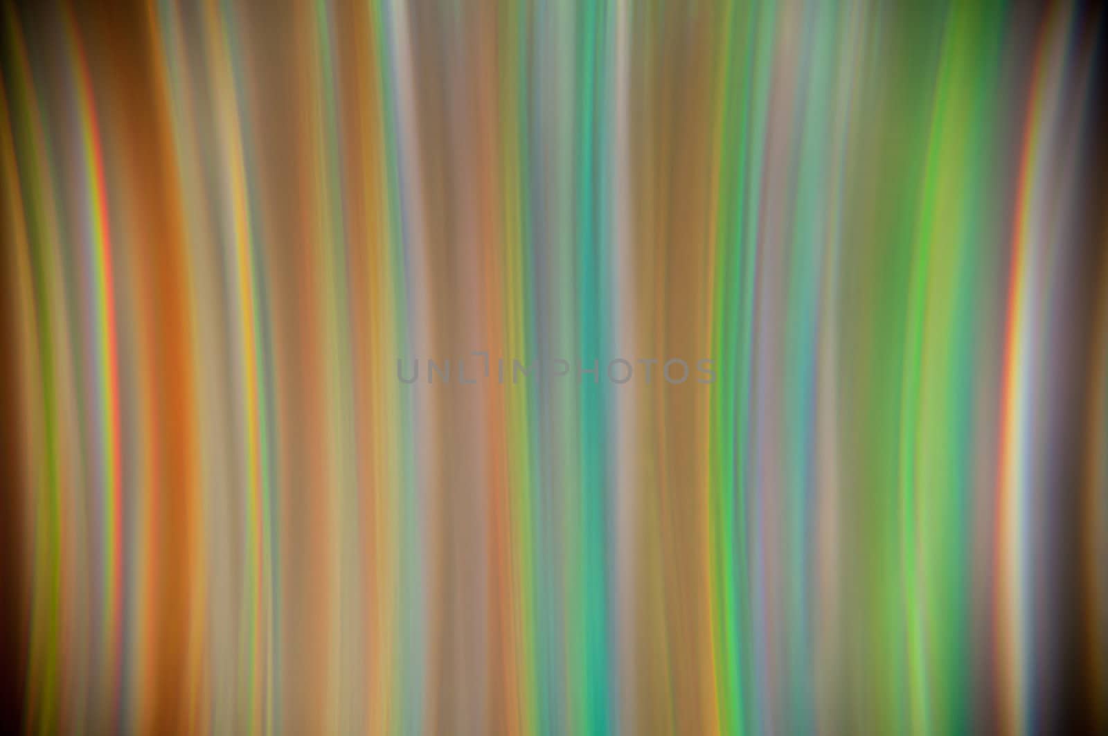 Background, a rainbow of colored vertical colored stripes.
