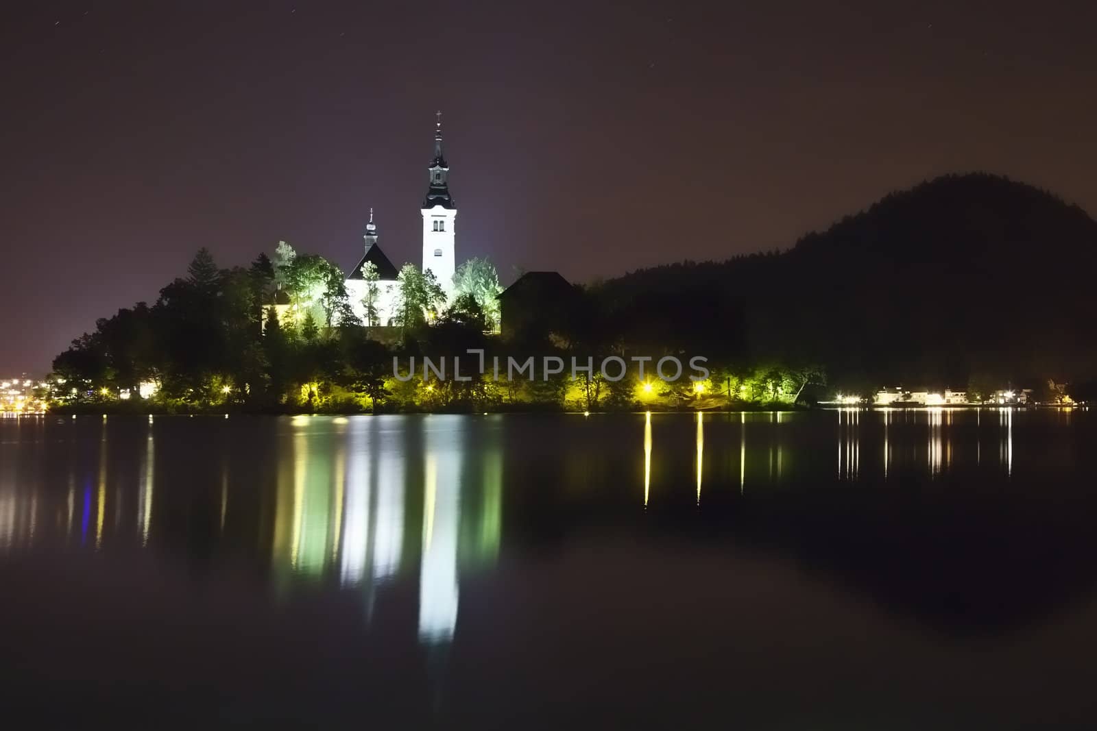 Night picture - Panorama of church on the island in Bled Lake - one of the most beautiful regions of Julian Alps in Slovenia