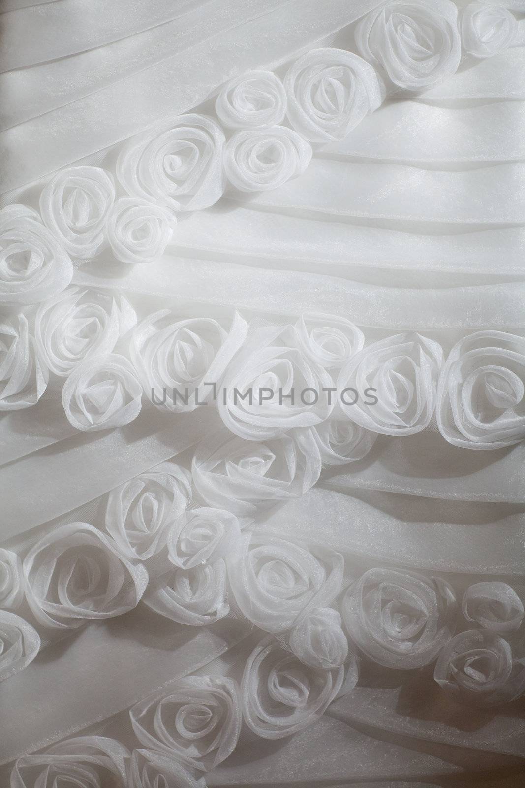 part of the white wedding dress with artificial flowers
