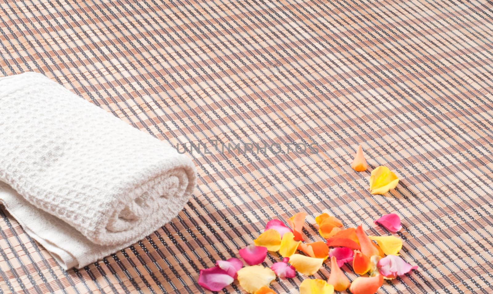 Studio shot of spa accessories, bamboo mat