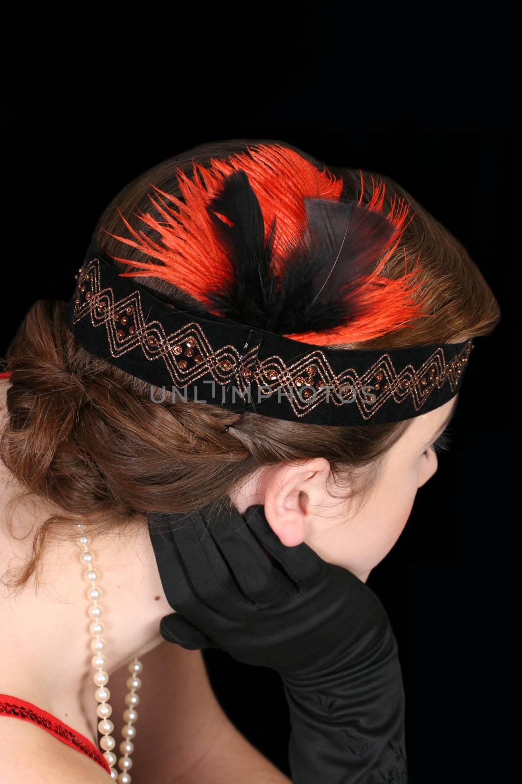 Beautiful 1920 hair style with headband and feathers