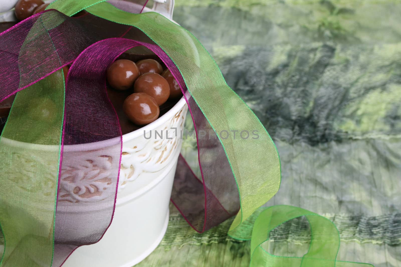 Decorative bucket with chocolate and organza ribbon