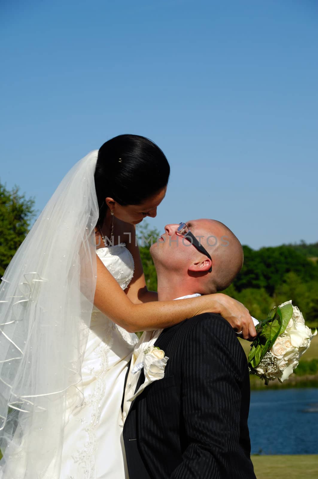 Groom waiting for a kiss by cfoto