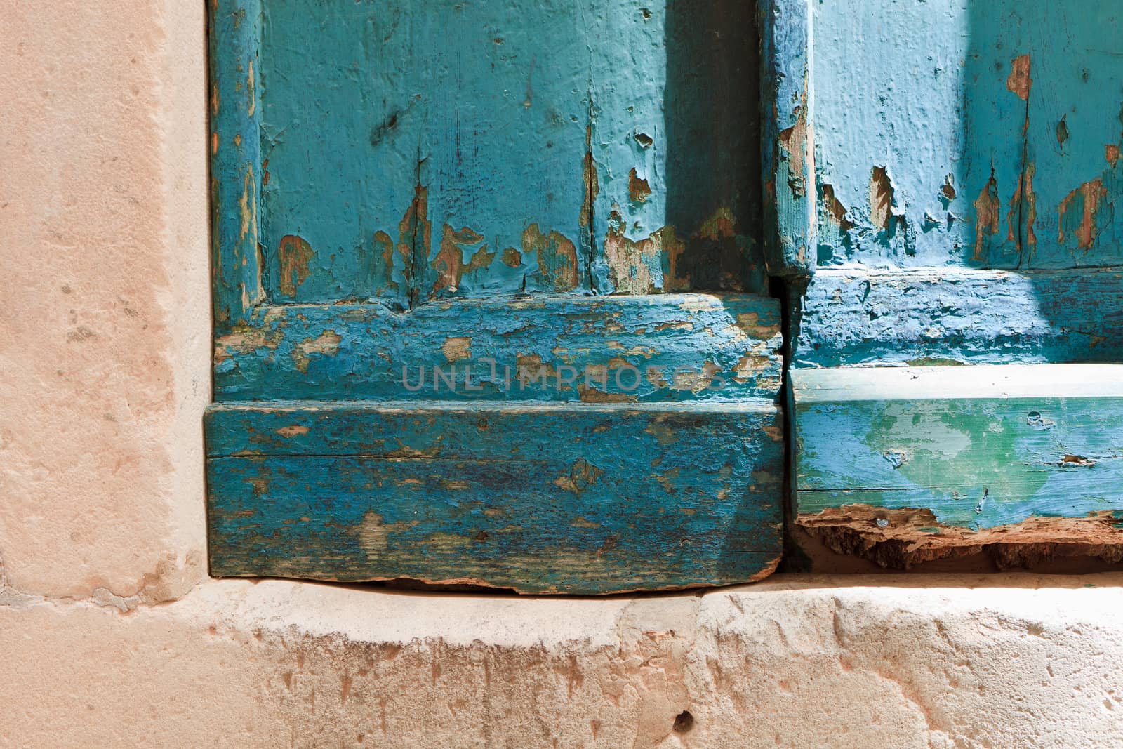 Old blue wooden door with peeling paint