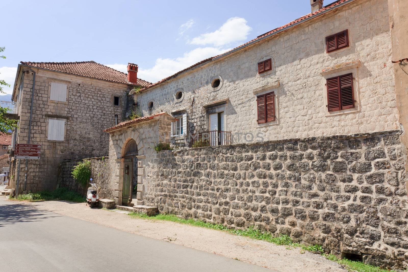 Old stone house with round windows