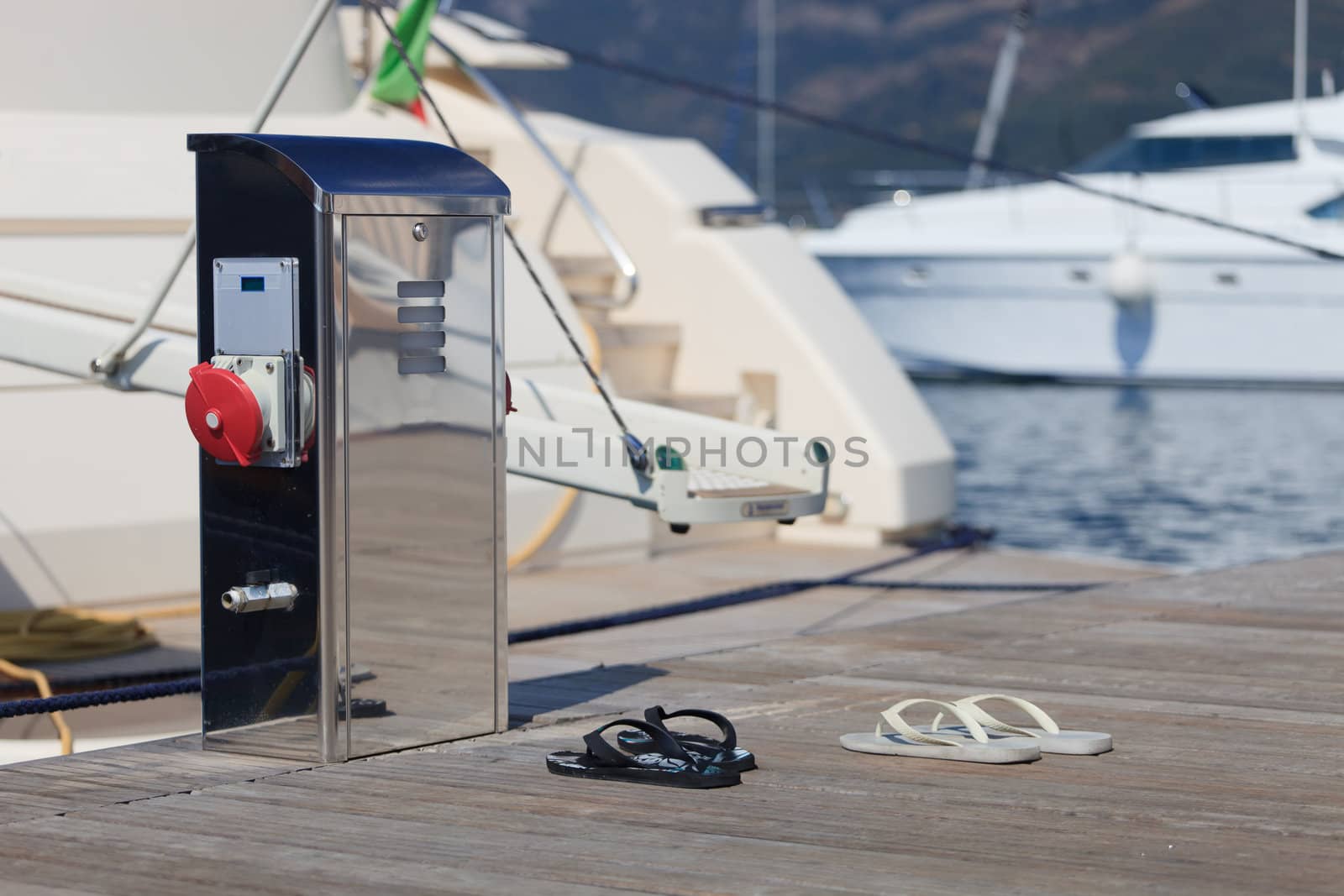 power outlet and shoes on a wooden dock