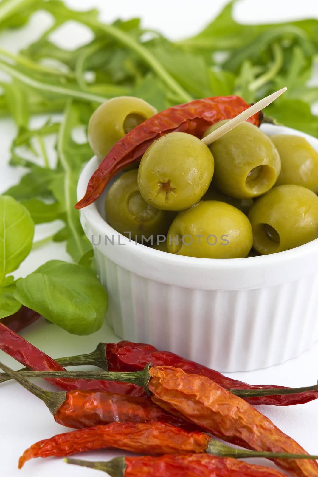 green olives, chili, basil and rucola by miradrozdowski