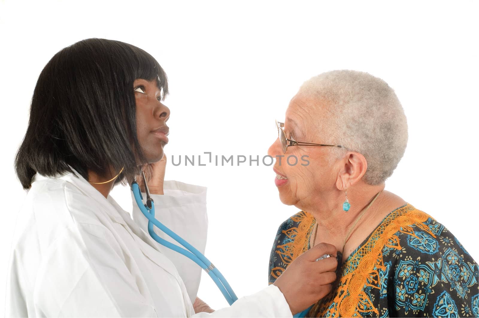 young african american doctor checking elderly patients heartbeat, isolated on white background