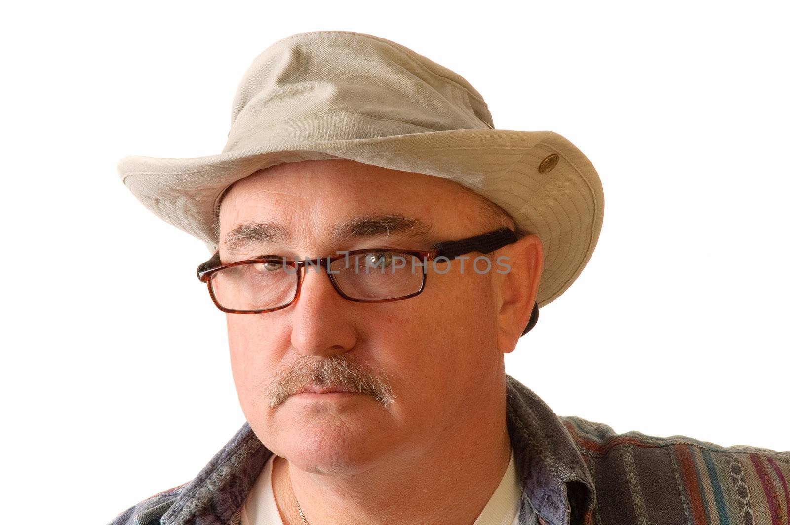 older man with spectacles on and a floppy hat isolated on white