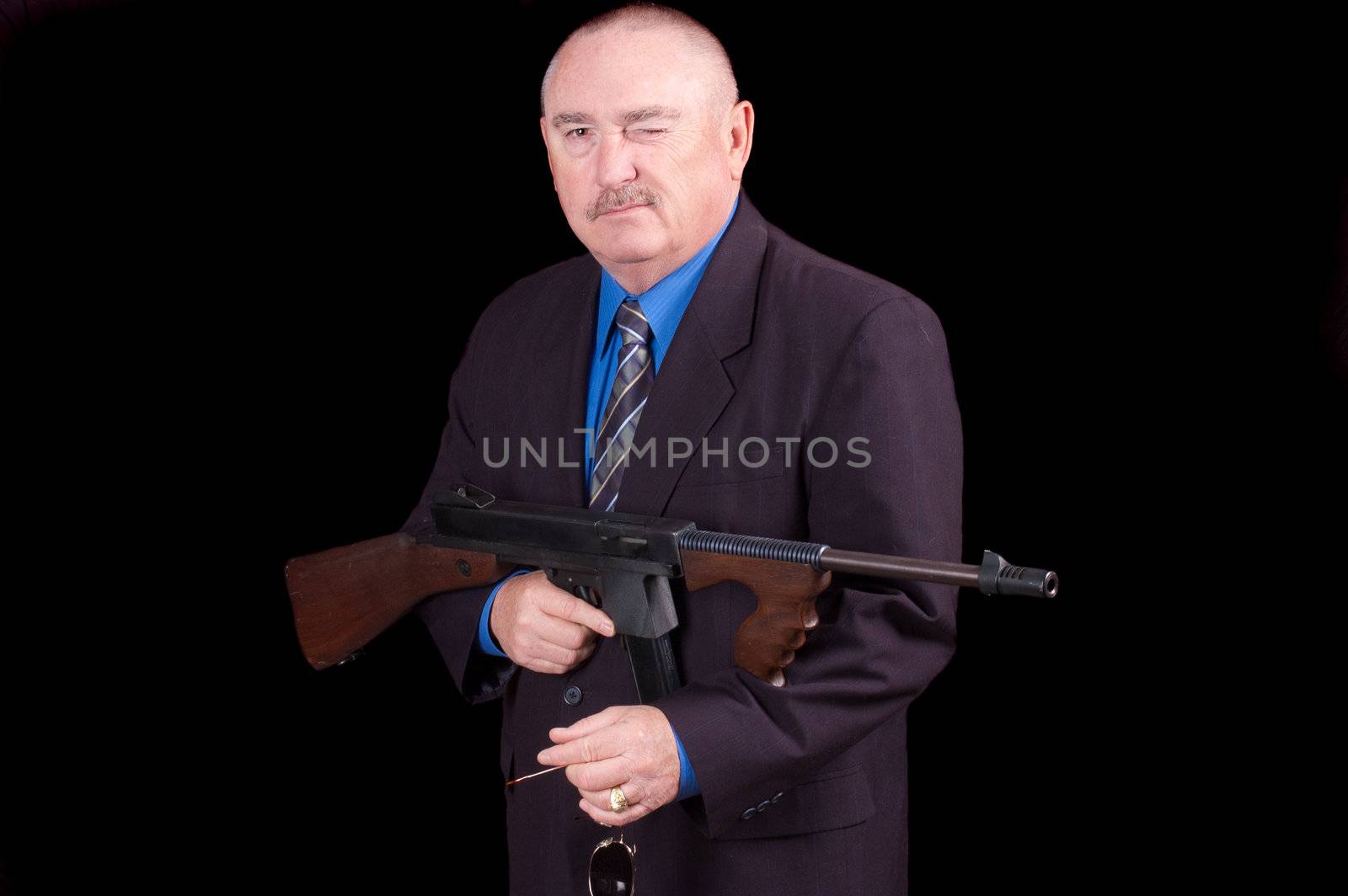 Gangster or Government agent, FBI agent, over a black background, winking at the camera
