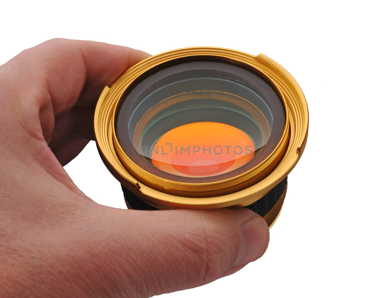 Gold auxiliary wide angle lens in hand isolated white background