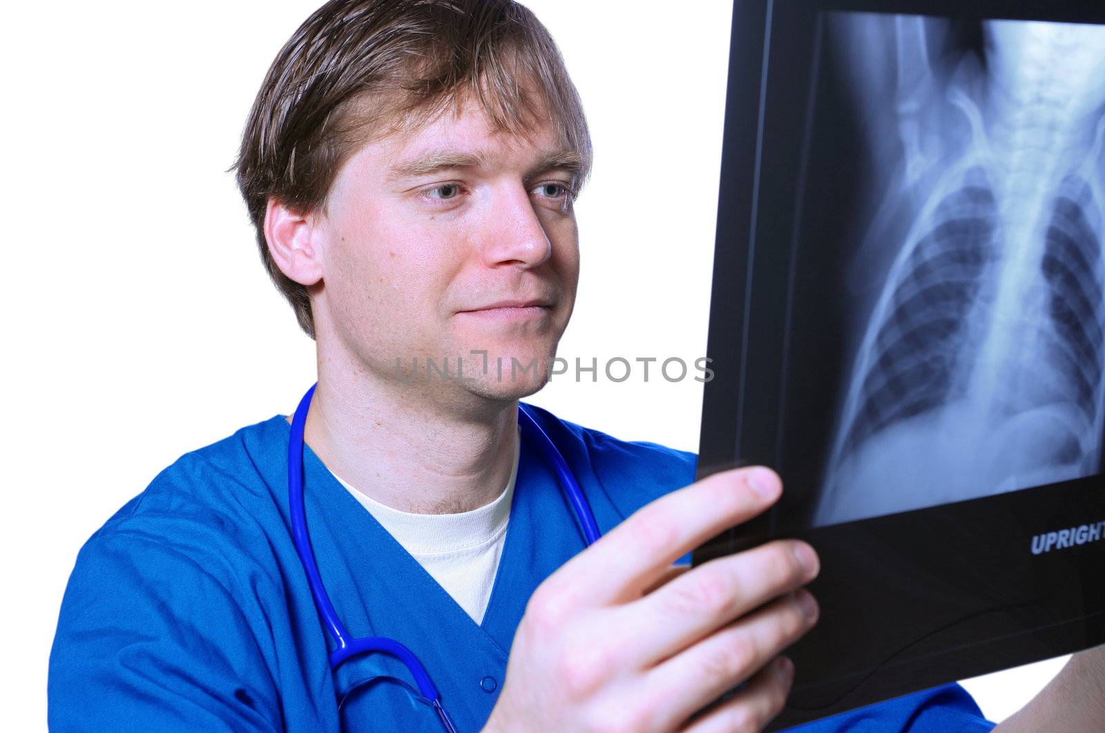 Male doctor looking at xray by jarenwicklund