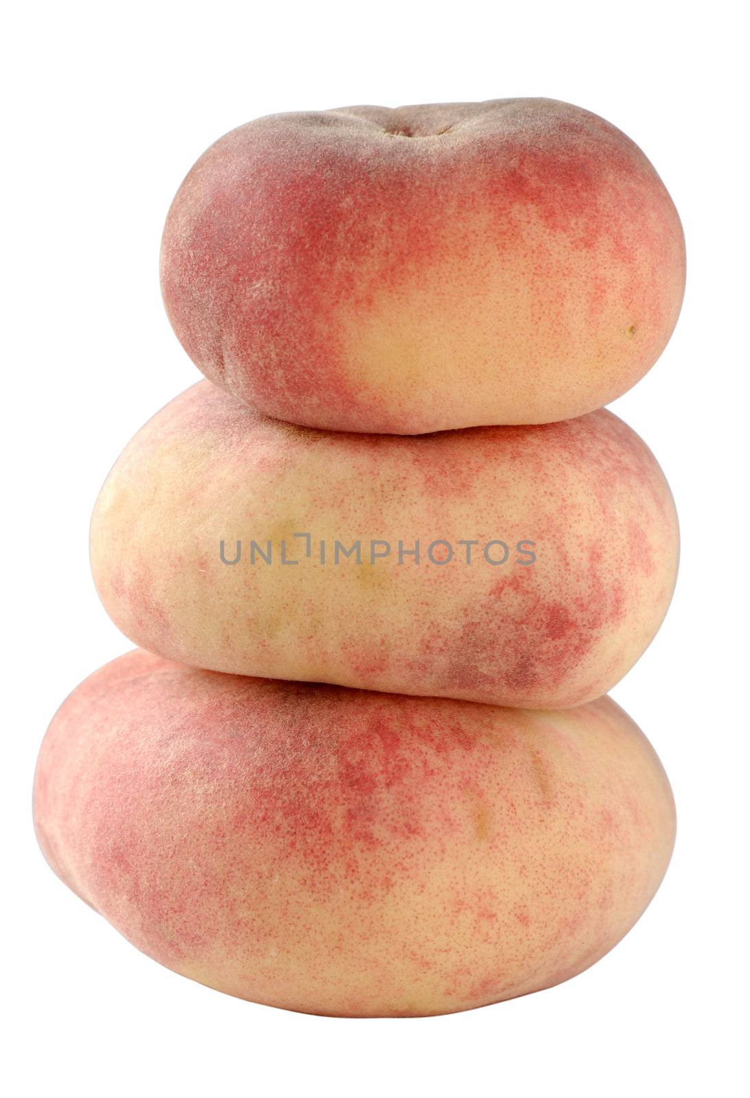 A stack of three flat "Doughnut" peaches, isolated on white with clipping path.
