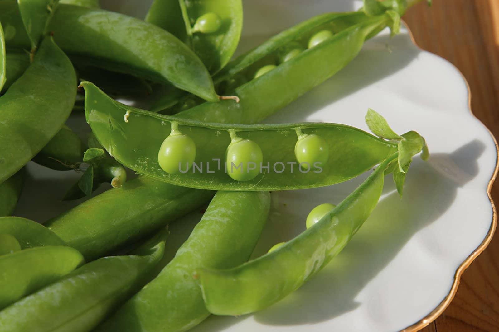 Green peas on a dish by NickS