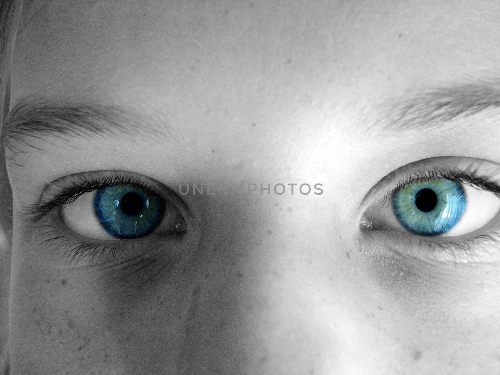 part of a face with blue eyes staring out.