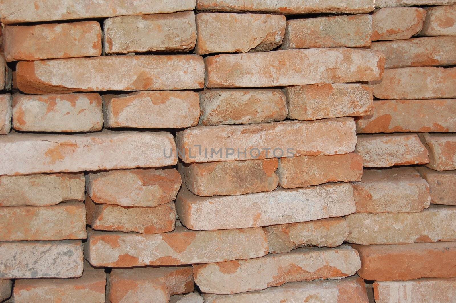 Stockpiled orange bricks