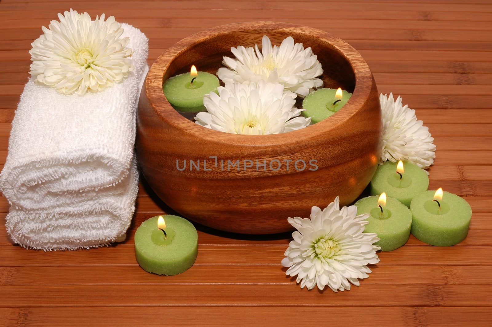 Flowers, candles, and cotton towels in a spa                         