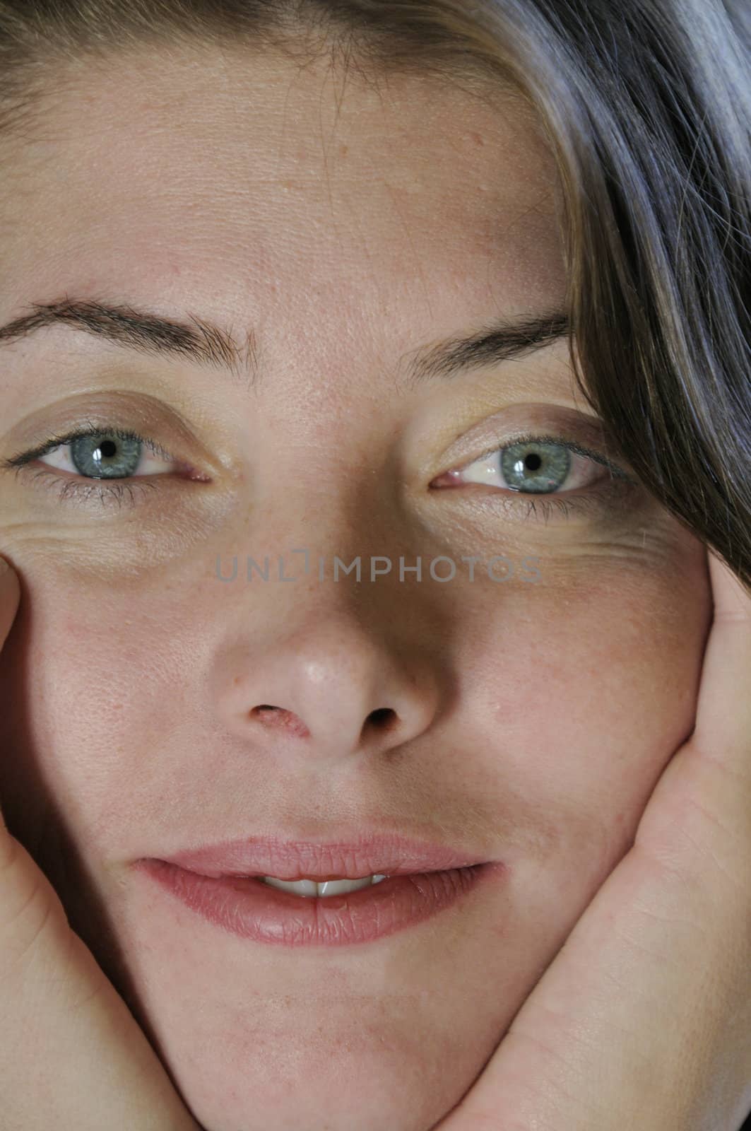 fresh, natural, smiling young mothers face in closeup