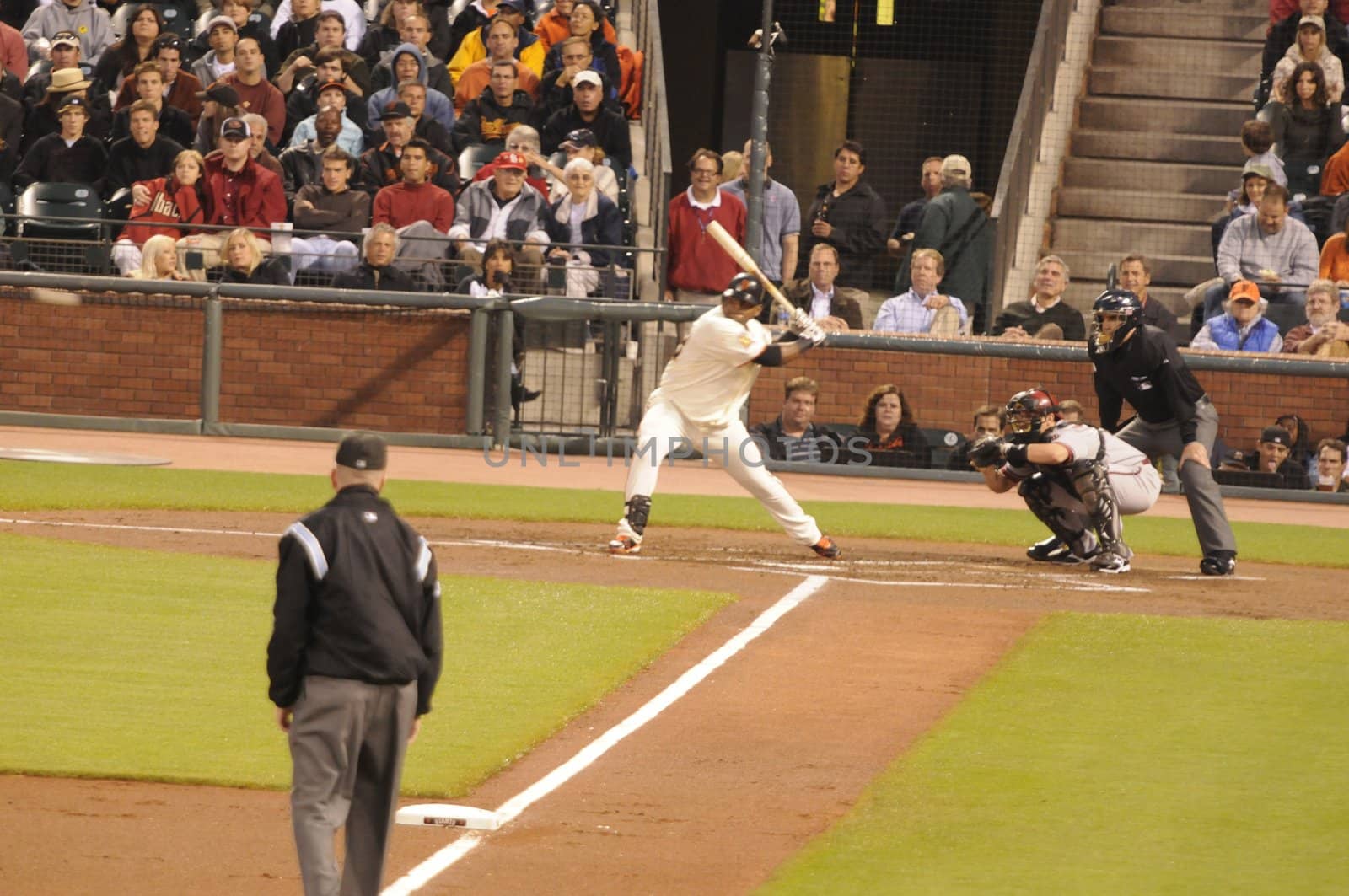 Sept 9 - San Francisco: Giants player taking a swing at a fast ball (just on the left edge of image blurred by the speed) during the game on 9/8/08 at the Giants stadium in San Francisco