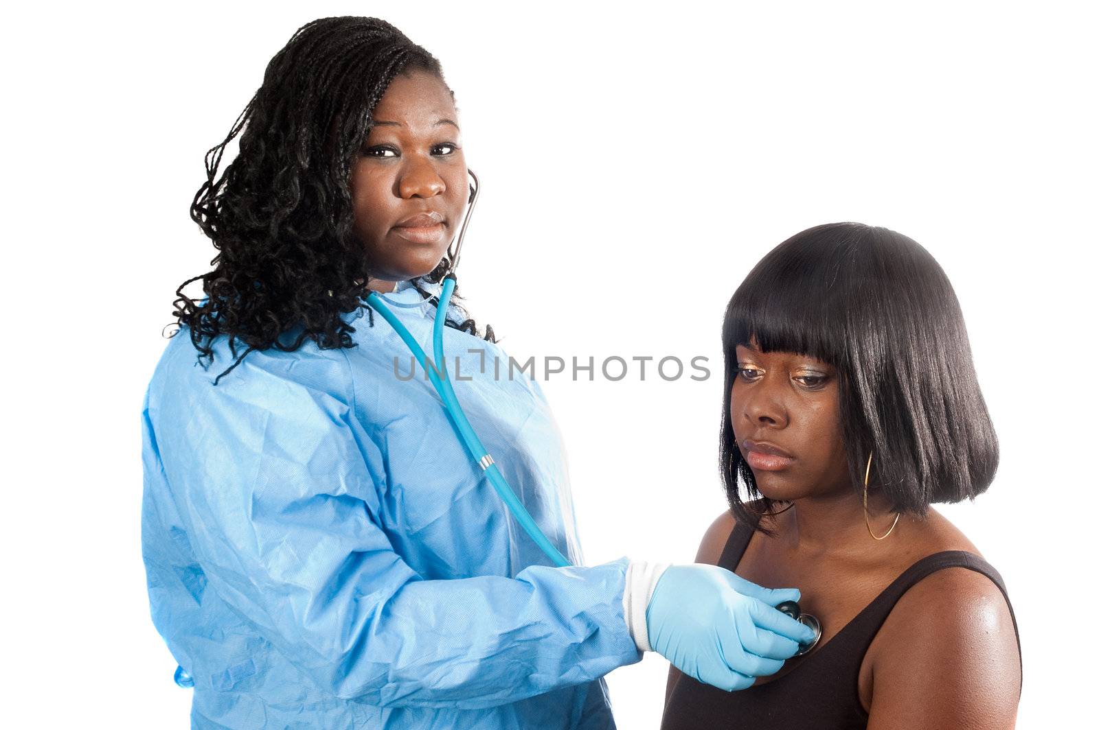African American nurse checking heartbeat of african American patient