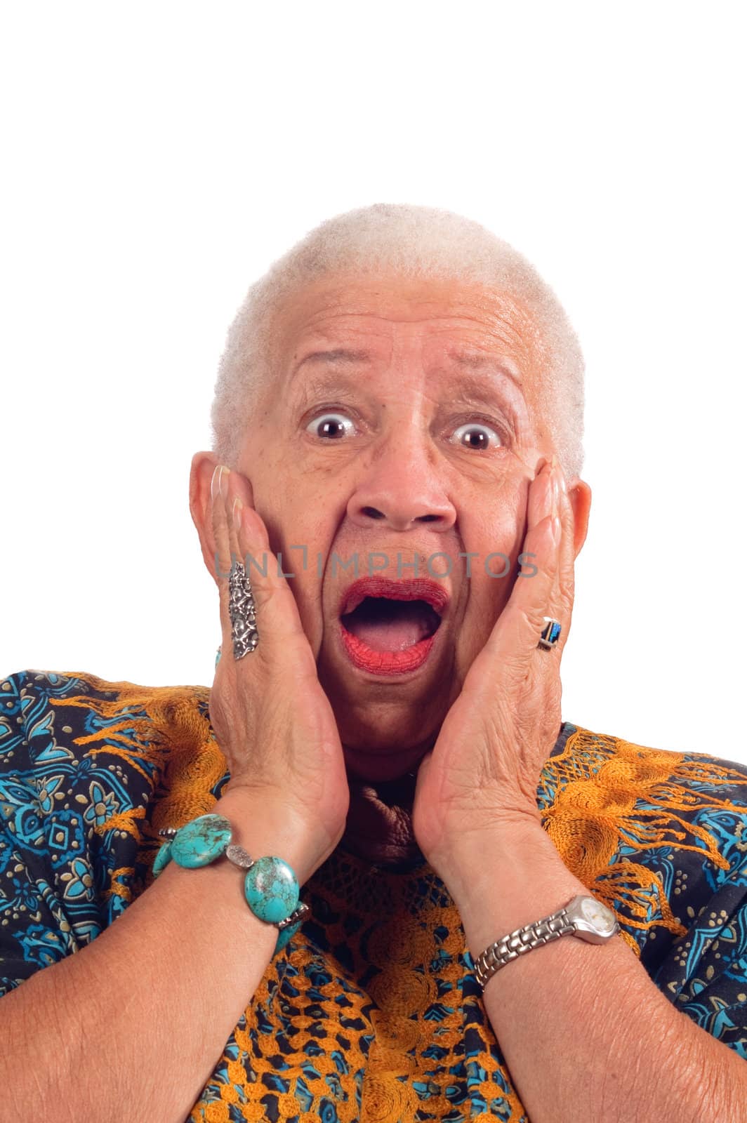 Elderly African American woman with a look of surprise isolated on white