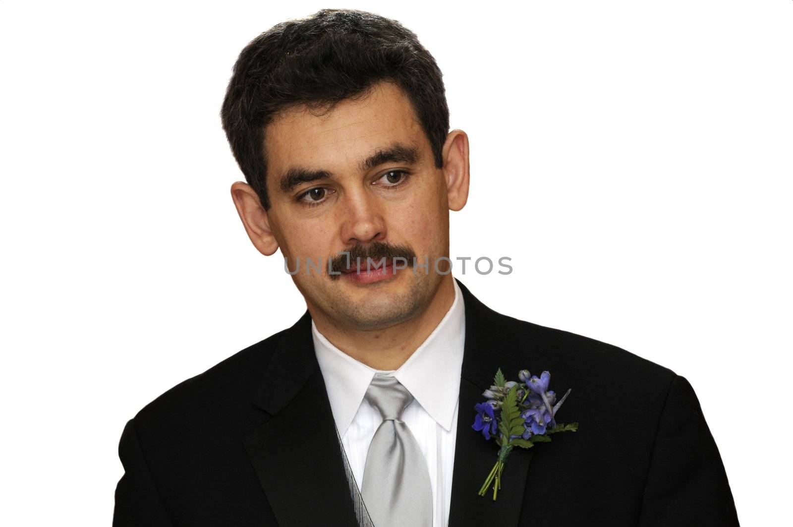 Groom at wedding looking very thoughtful isolated over white