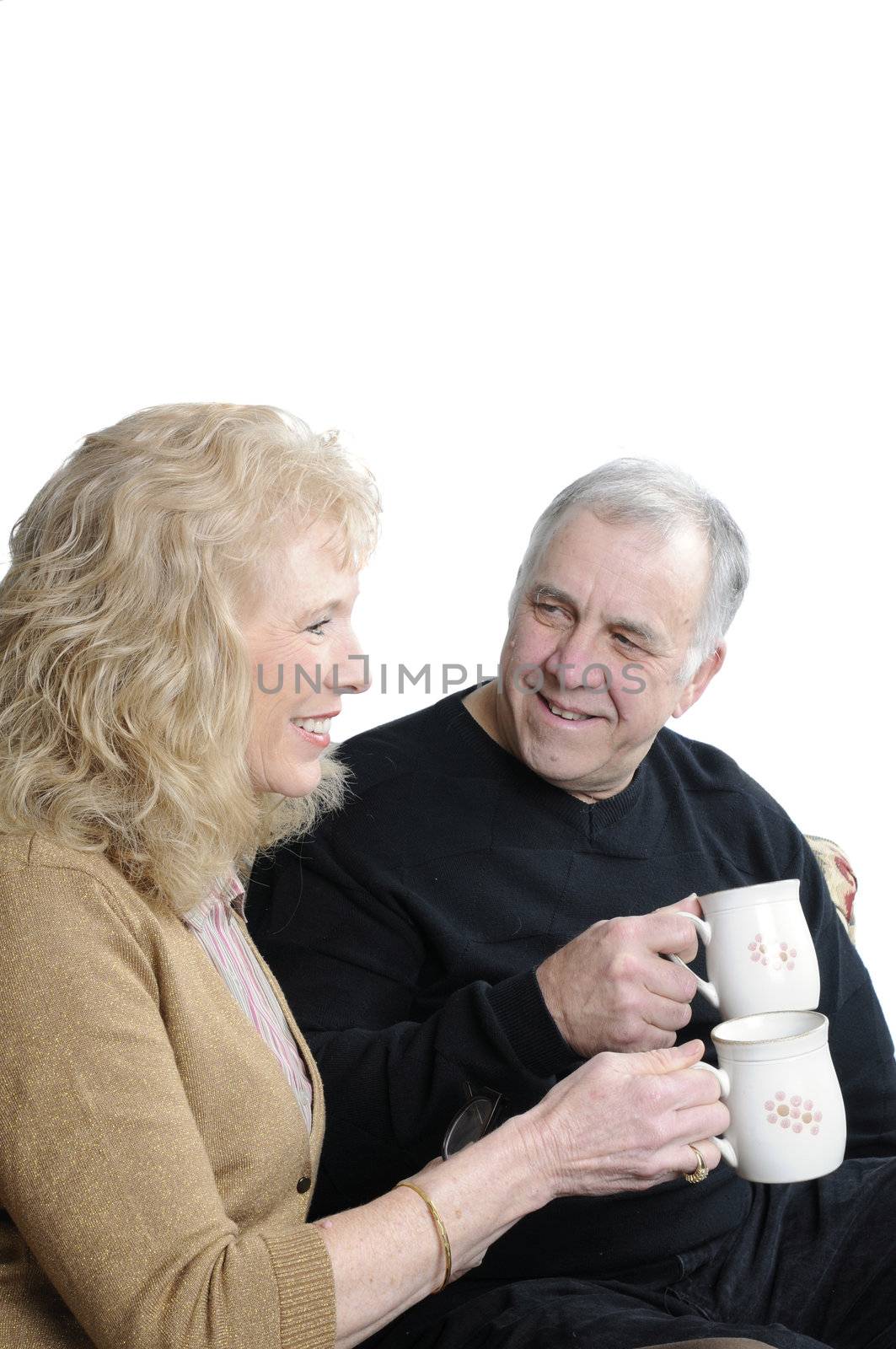 Older enjoying a cup of coffee together over a white background