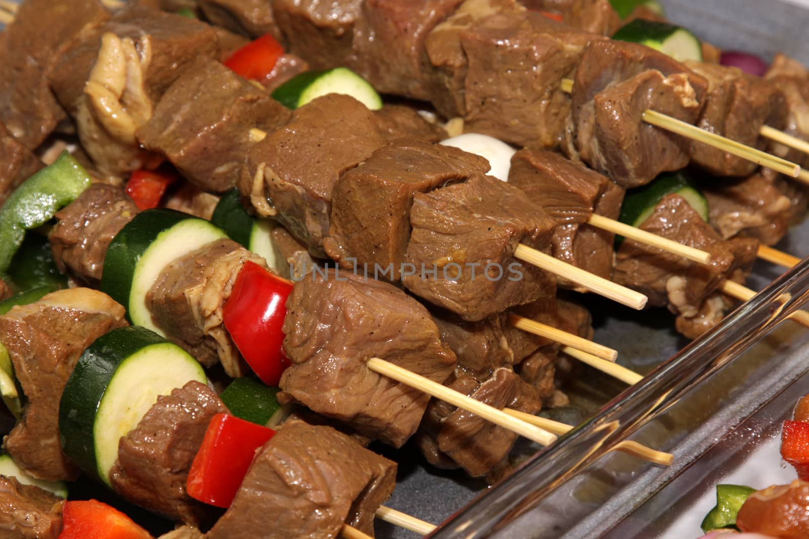 Beef kebabs sitting ready to go on the barbeque.
