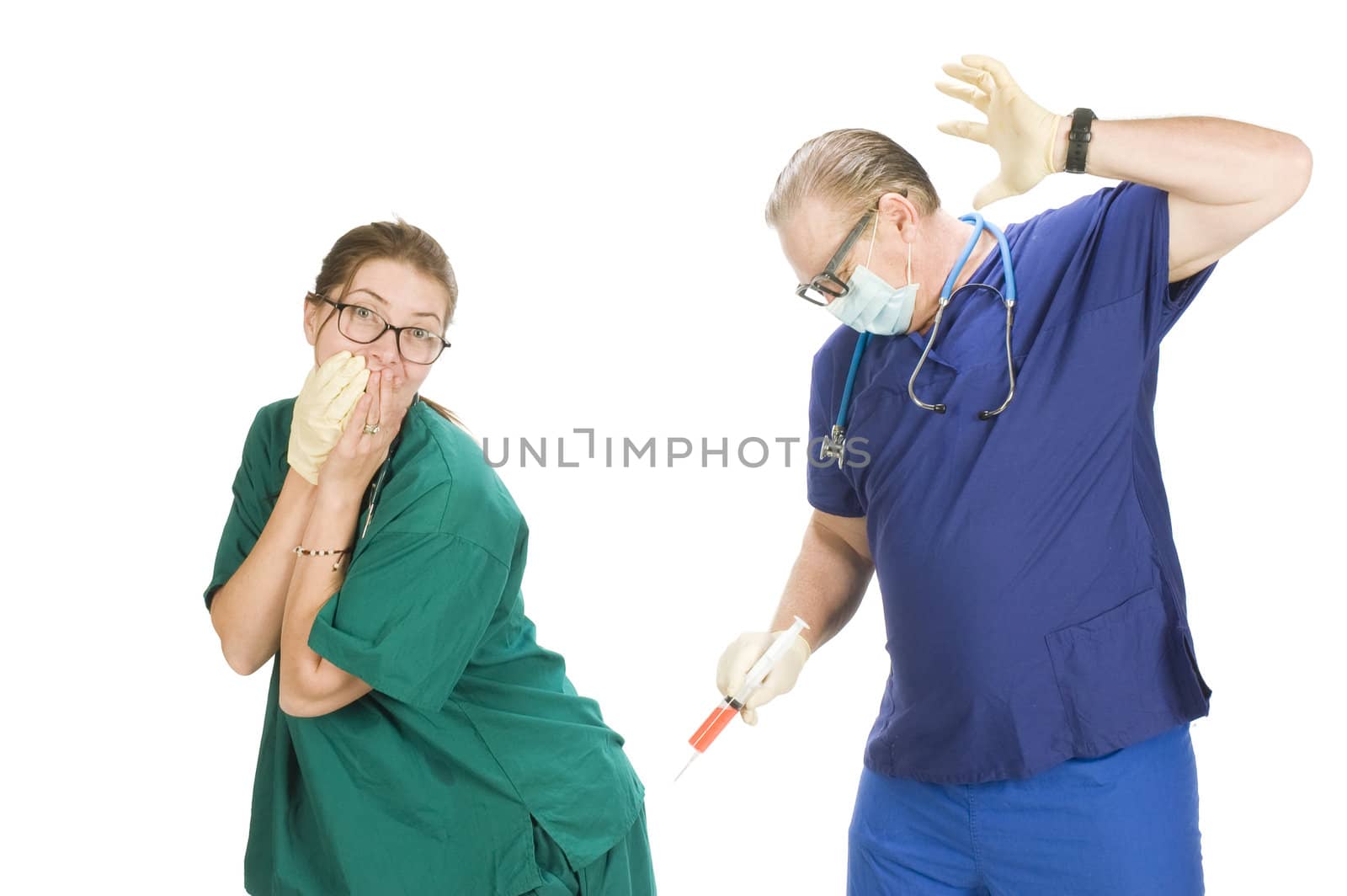 Male nurse and  doctor fooling around with syringe,  isolated on white