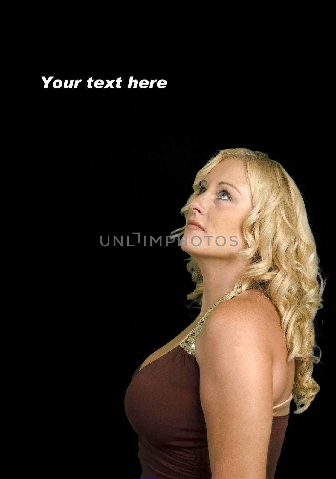 Attractive blond looking up over black with copy space for your text