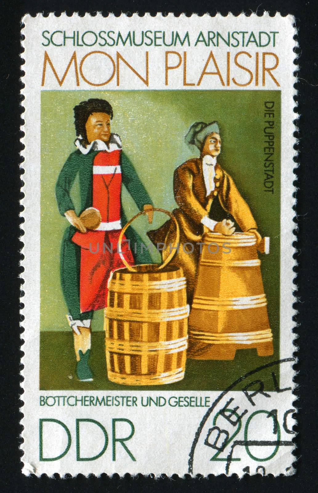 GERMANY  - CIRCA 1974: FScenes from 18th century Thurigia, Dolls Village, Arnstadt Castle Museum. Cooper and apprentice,  circa 1974.