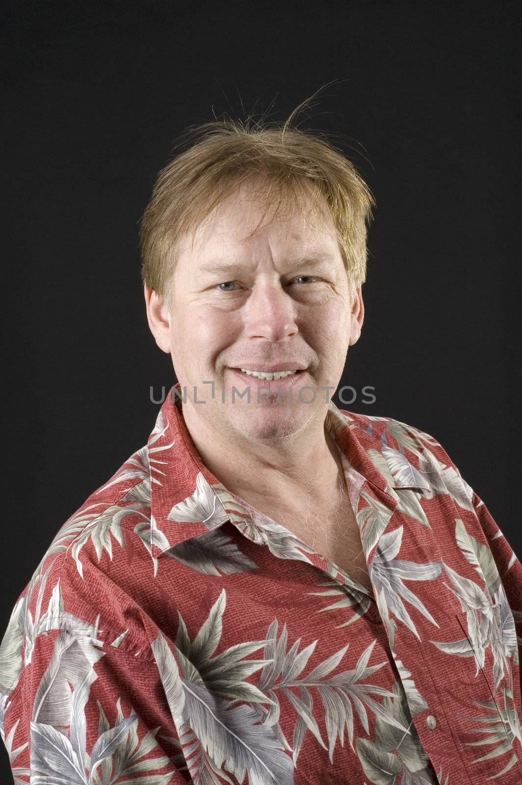 middle aged man in floral shirt man isolated on black