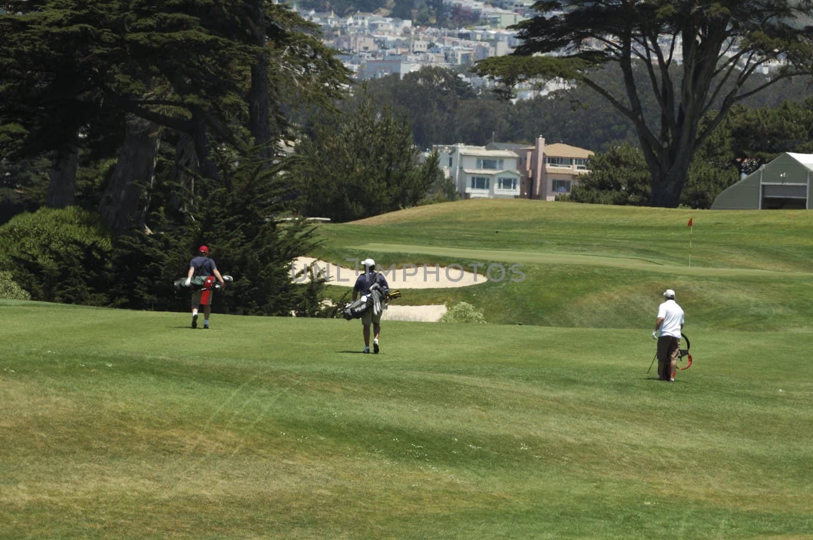 3 Golfers walking the course