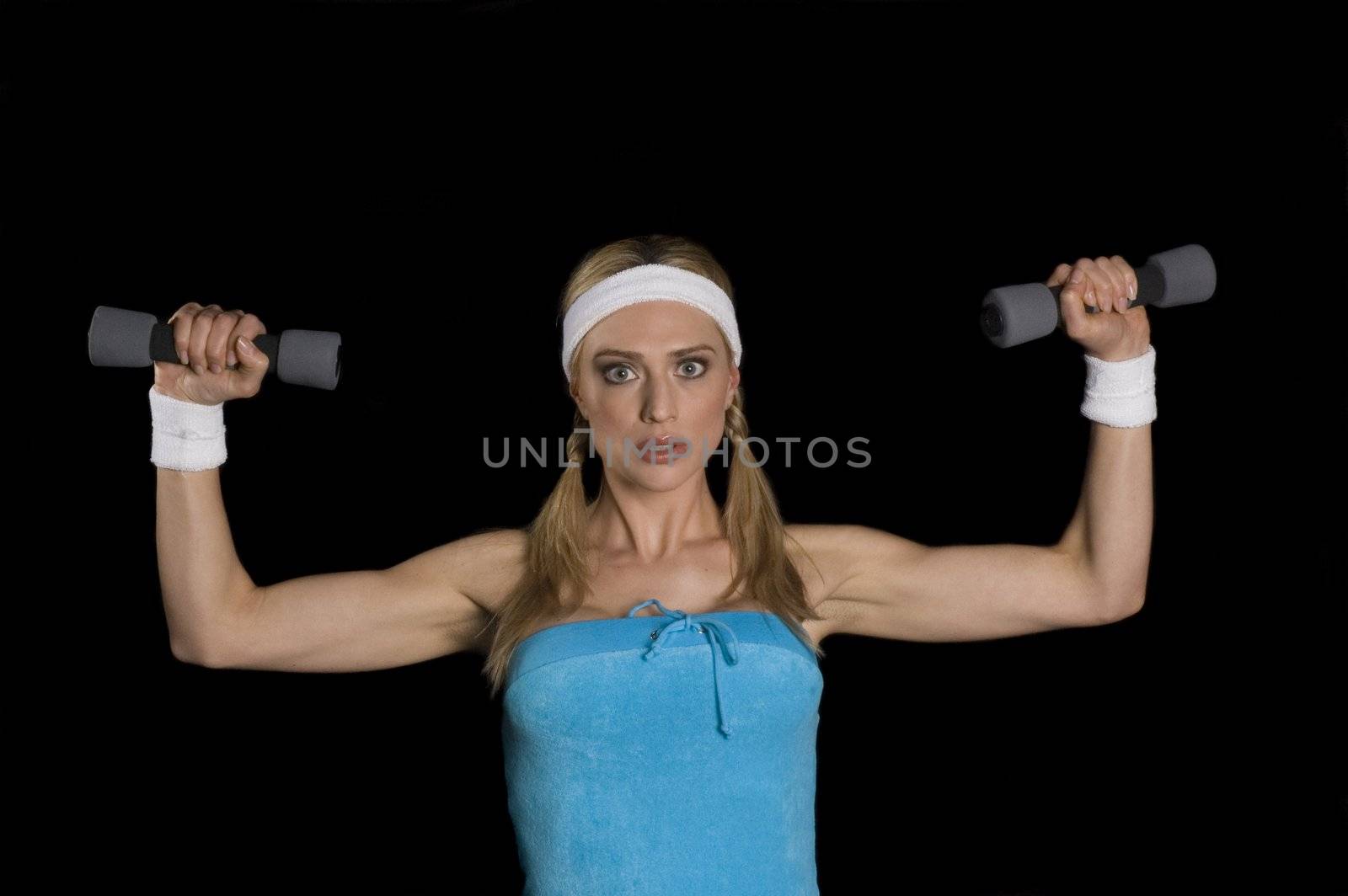 Attractive woman weightlifting isolated on black