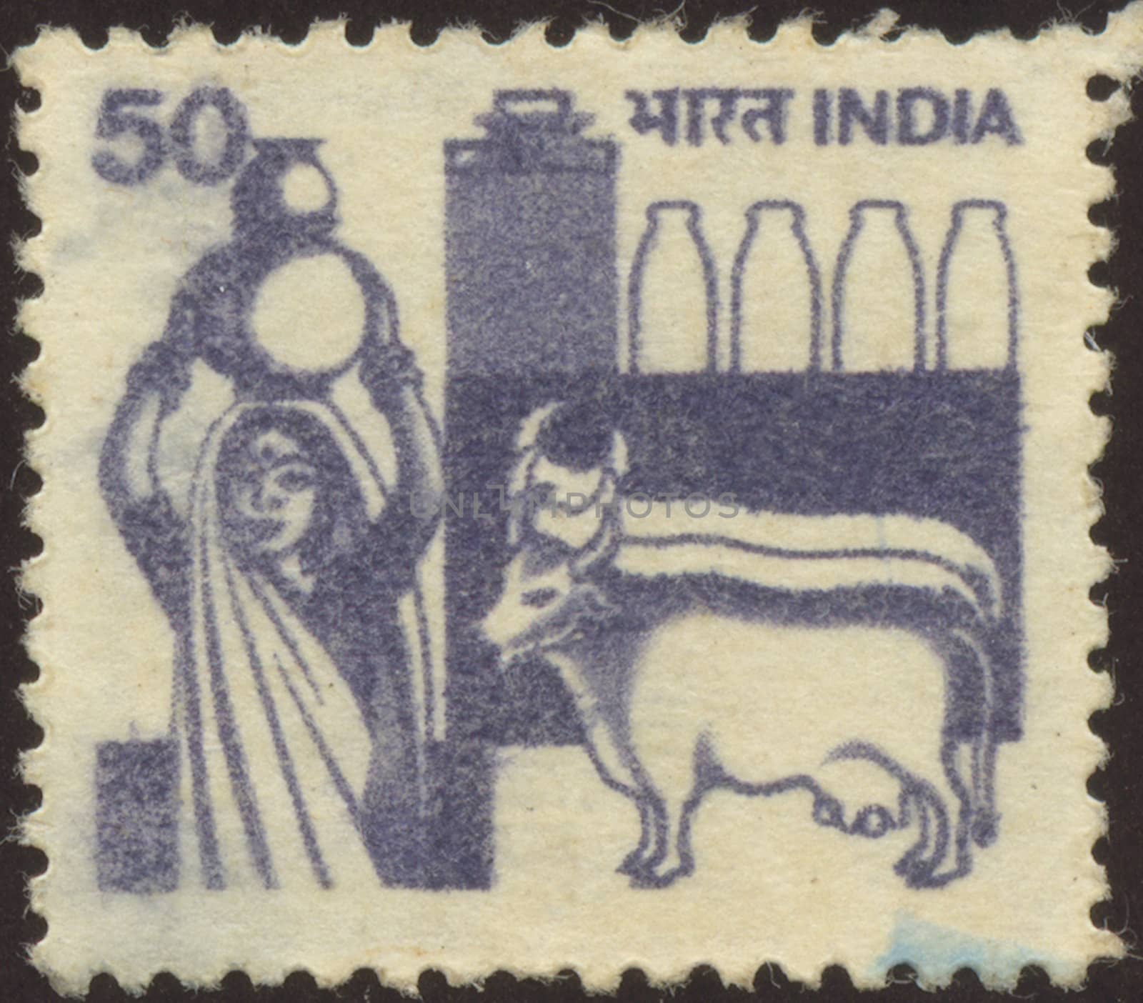 The scanned stamp. The Indian stamp. The woman bears a jug.