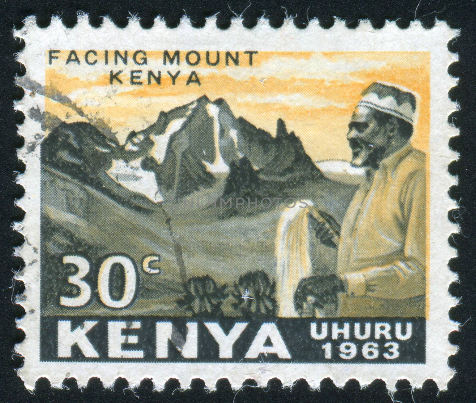 KENYA - CIRCA 1963: The Kenyan man against mountains, circa 1963.