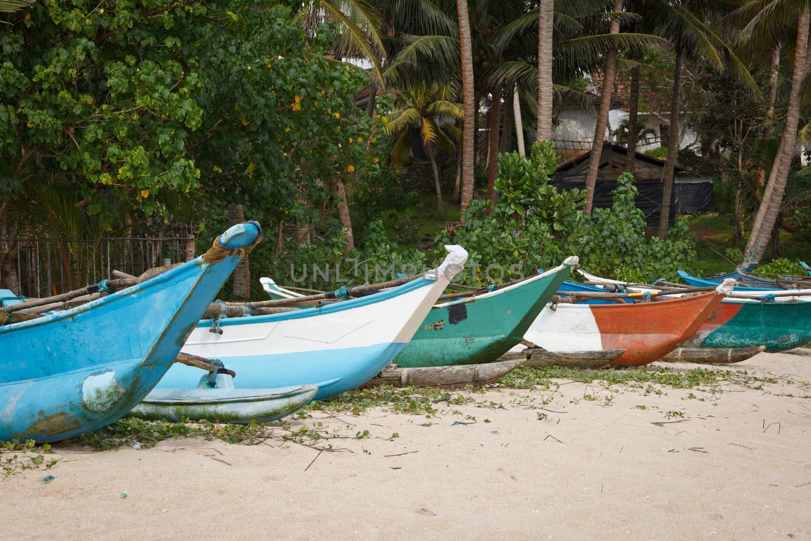 Fishing boats on beach by dimol