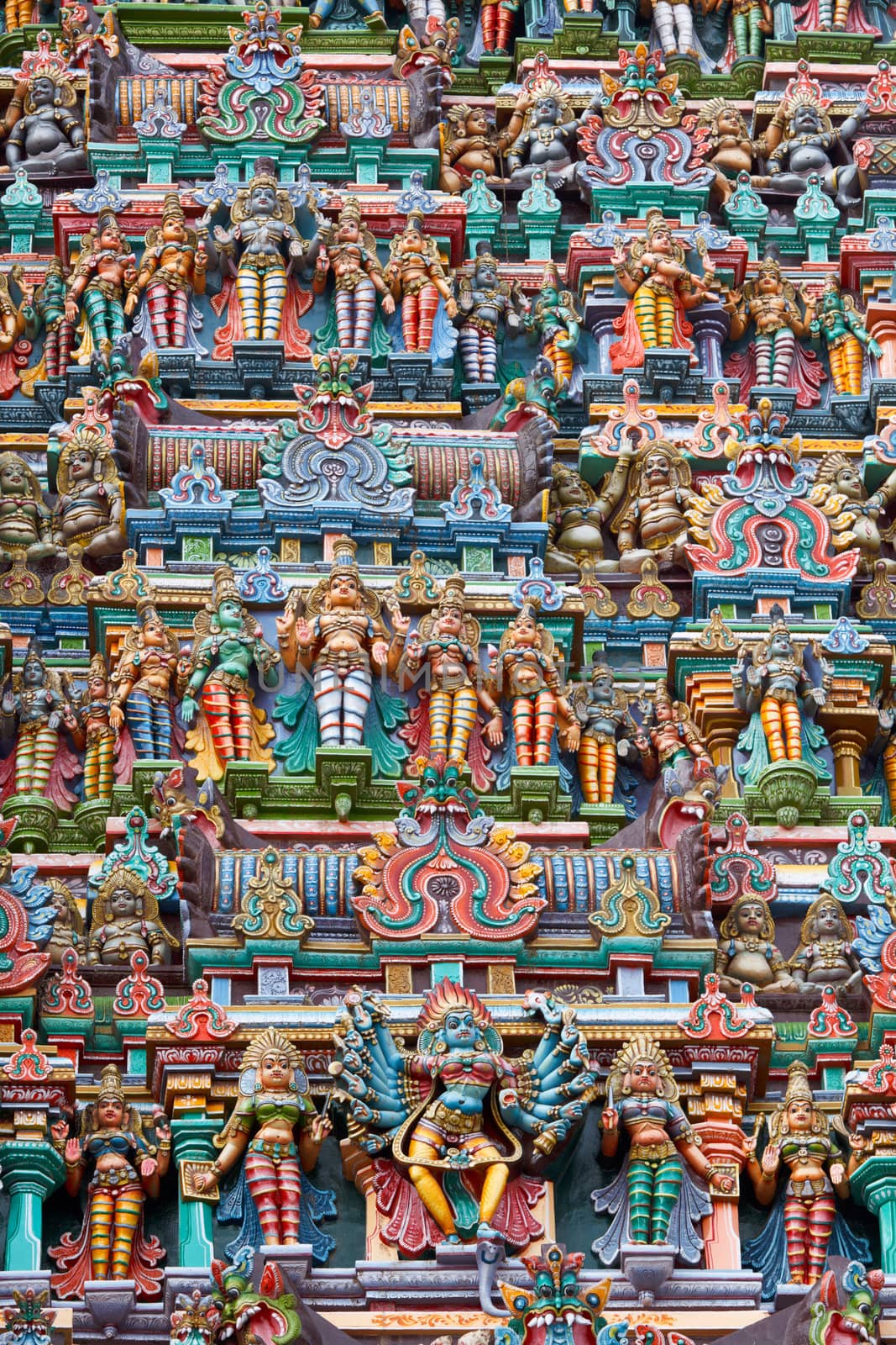 Sculptures on Hindu temple gopura (tower). Menakshi Temple, Madurai, Tamil Nadu, India