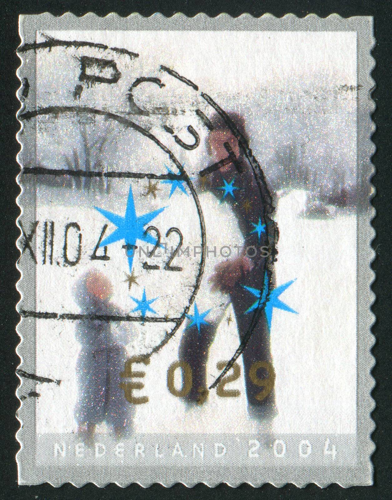 NETHERLANDS - CIRCA 2004: Children making snowman, circa 2004.