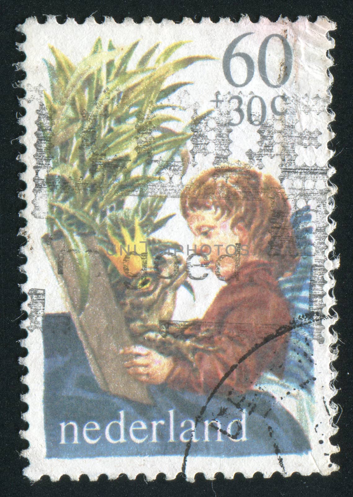 NETHERLANDS - CIRCA 1990: The boy reads the book, circa 1990.