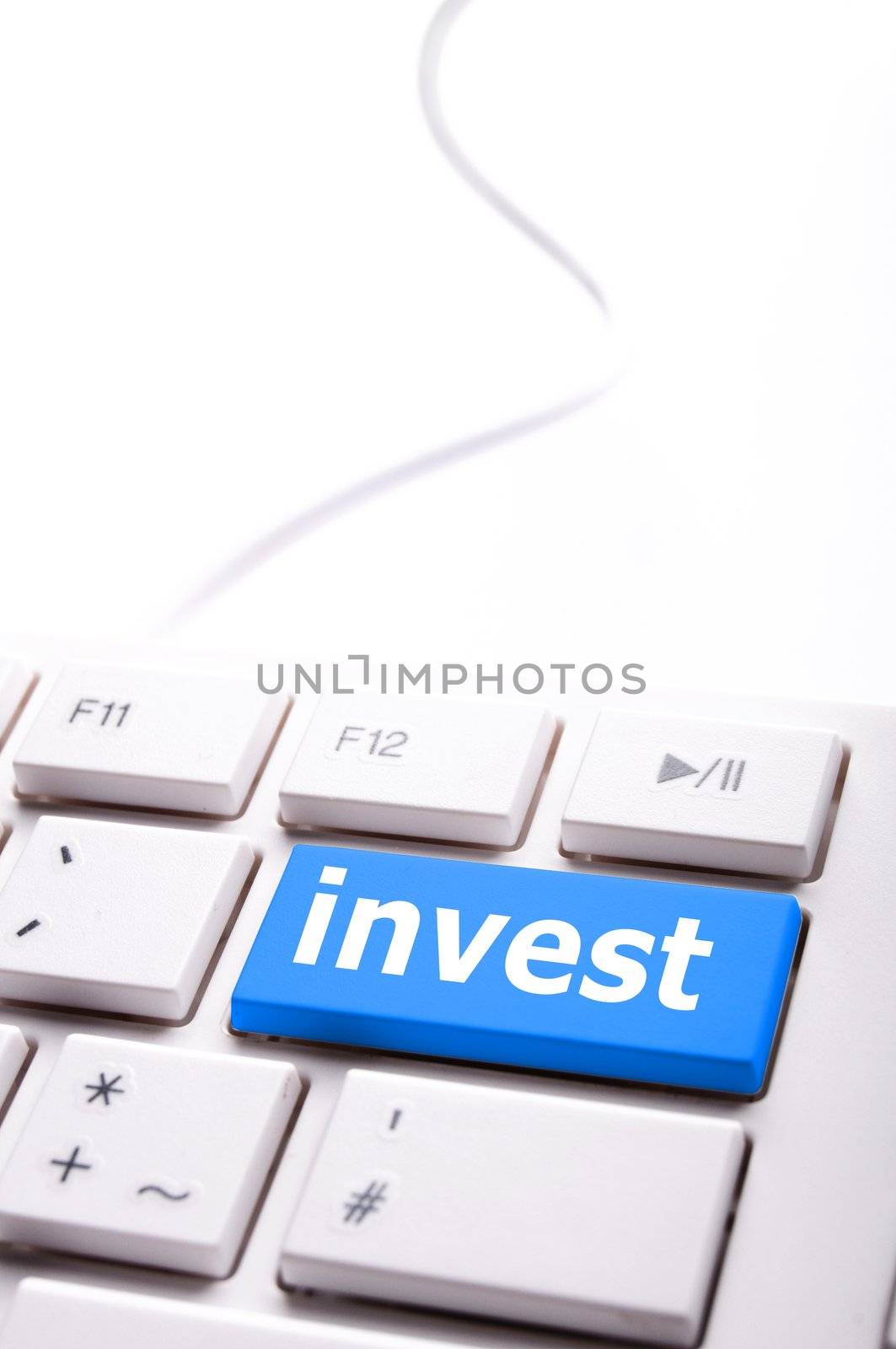 invest key on keyboard showing financial business investment concept