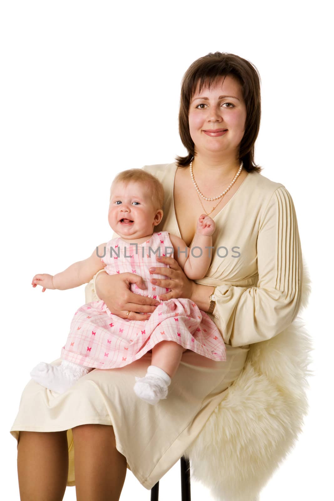 Mother with daughter sitting on chair isolated on white
