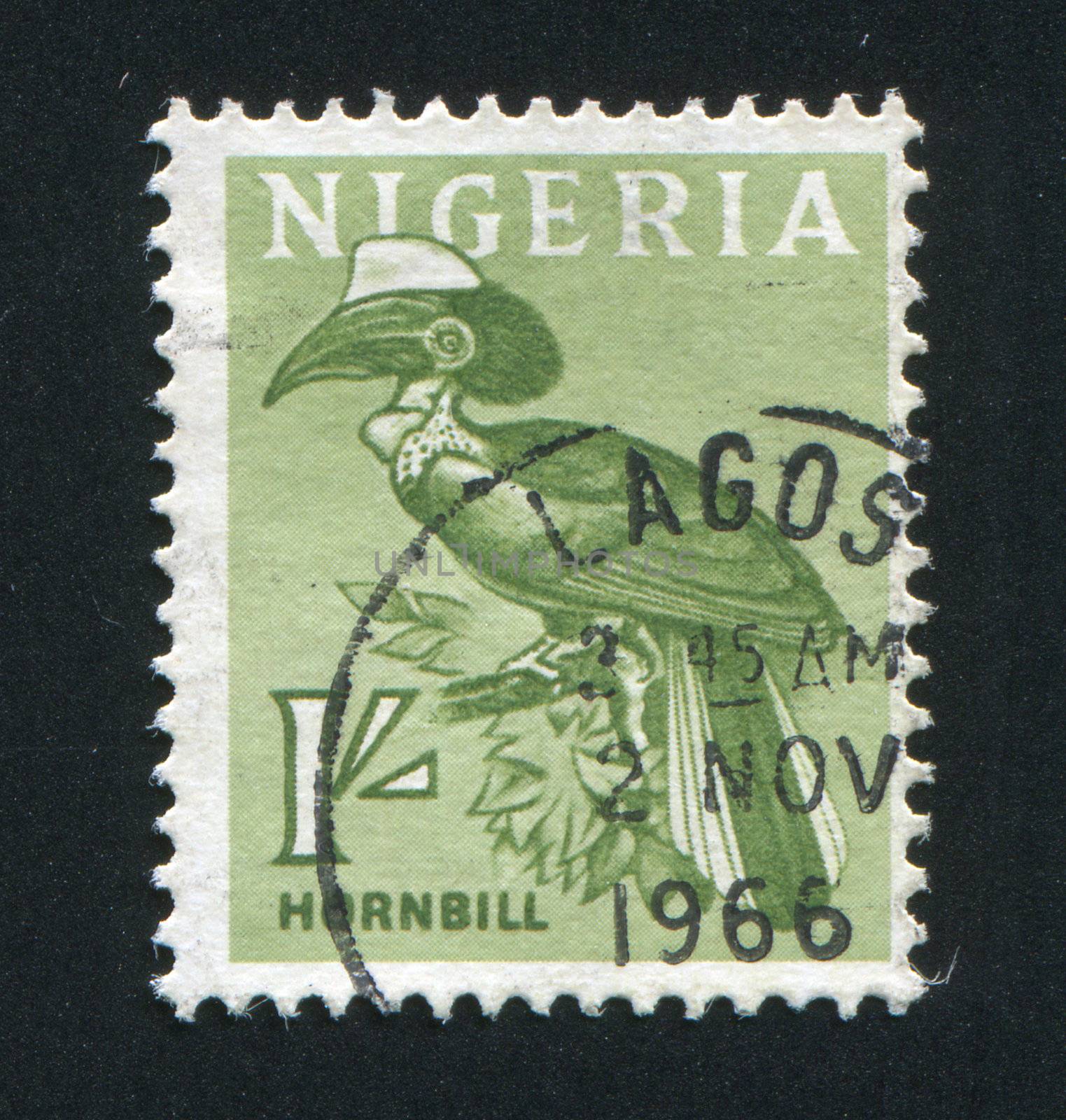 NIGERIA - CIRCA 1966:  The bird sits on a tree branch, circa 1966.