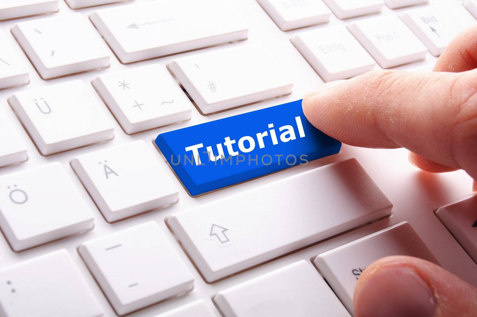 tutorial or e learning concept with key on computer keyboard