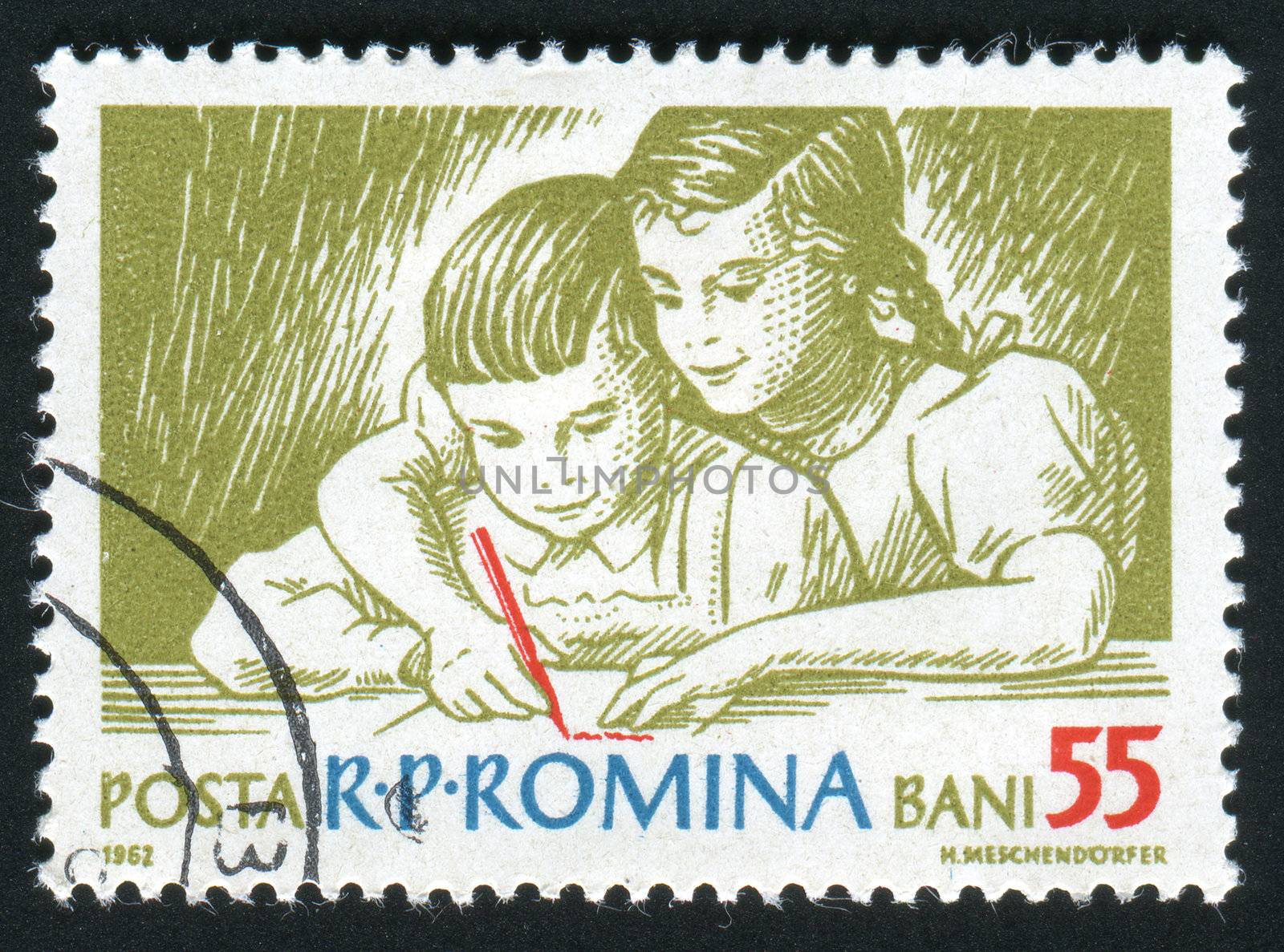 ROMANIA - CIRCA 1962: The child studies to write, circa 1962.